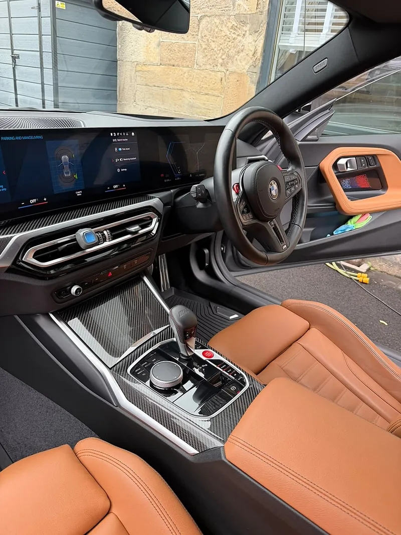 BMW interior with tan leather seats after a full valet