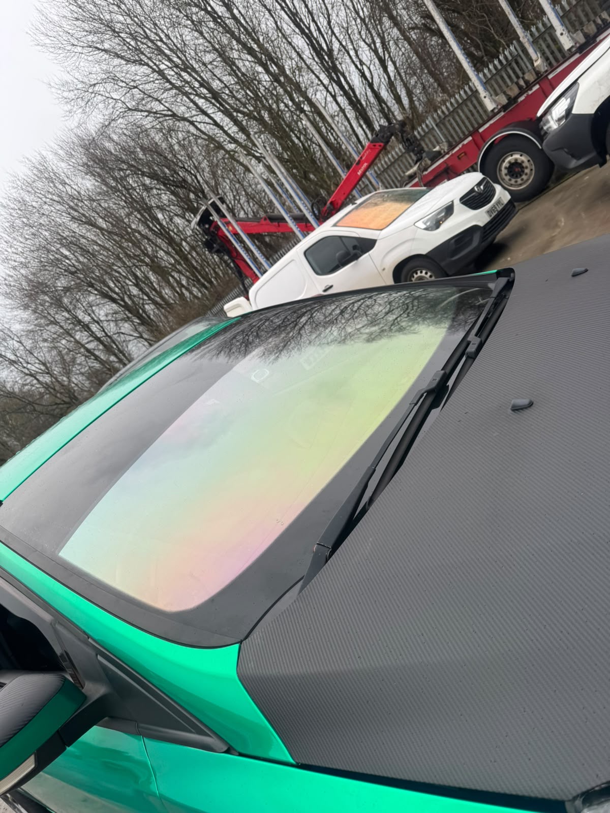 Chameleon tint with gold and purple shift fitted to a wrapped car