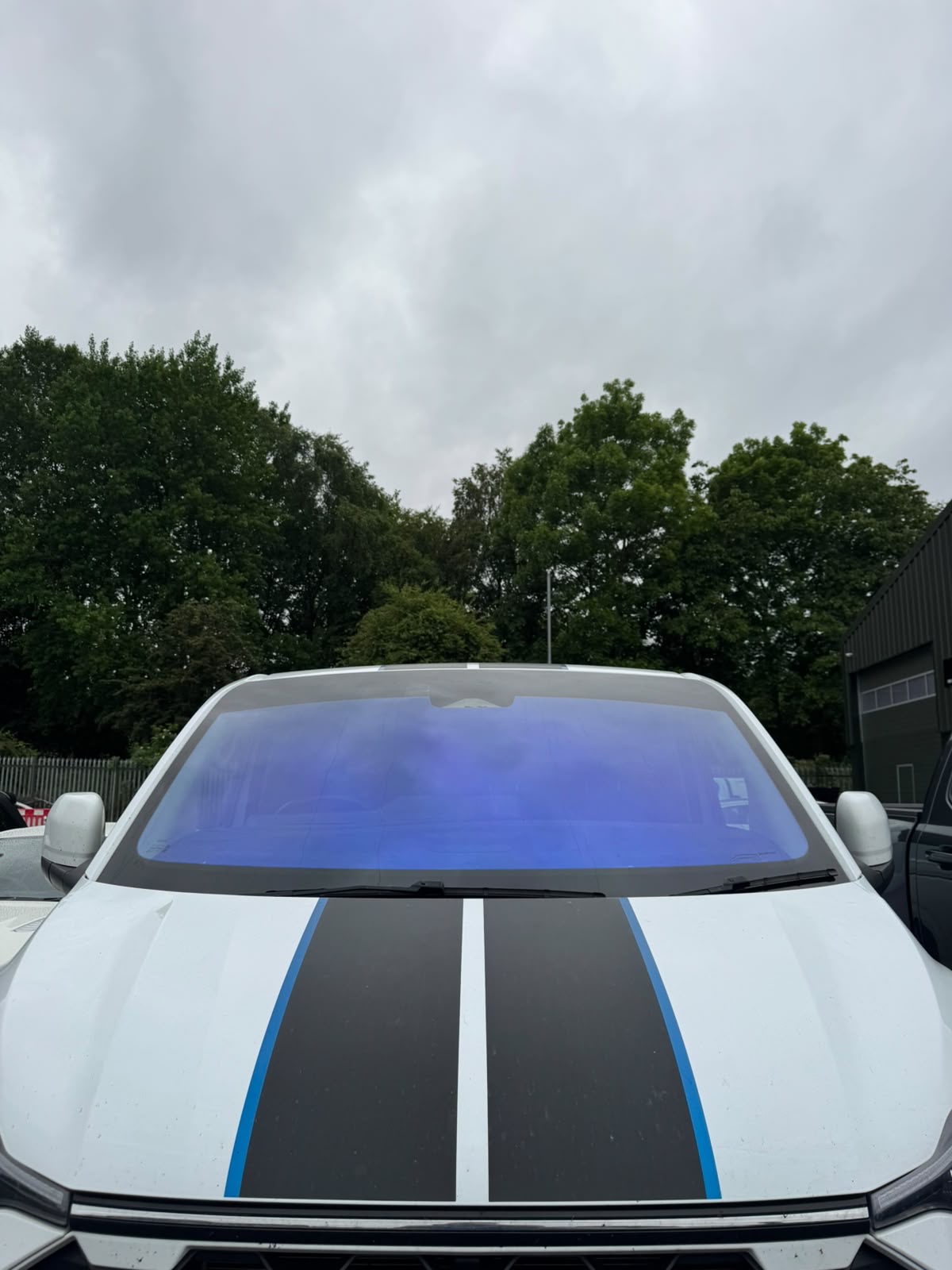 Colour-shifting chameleon windscreen tint fitted to a van