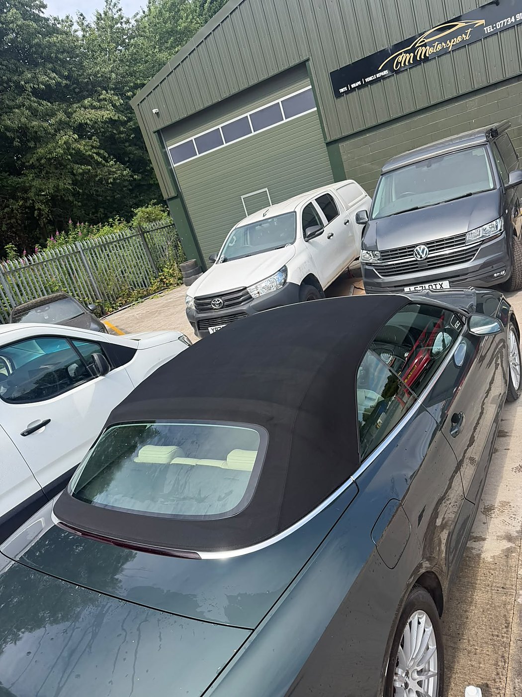 Convertible with the fabric soft top cleaned and protected