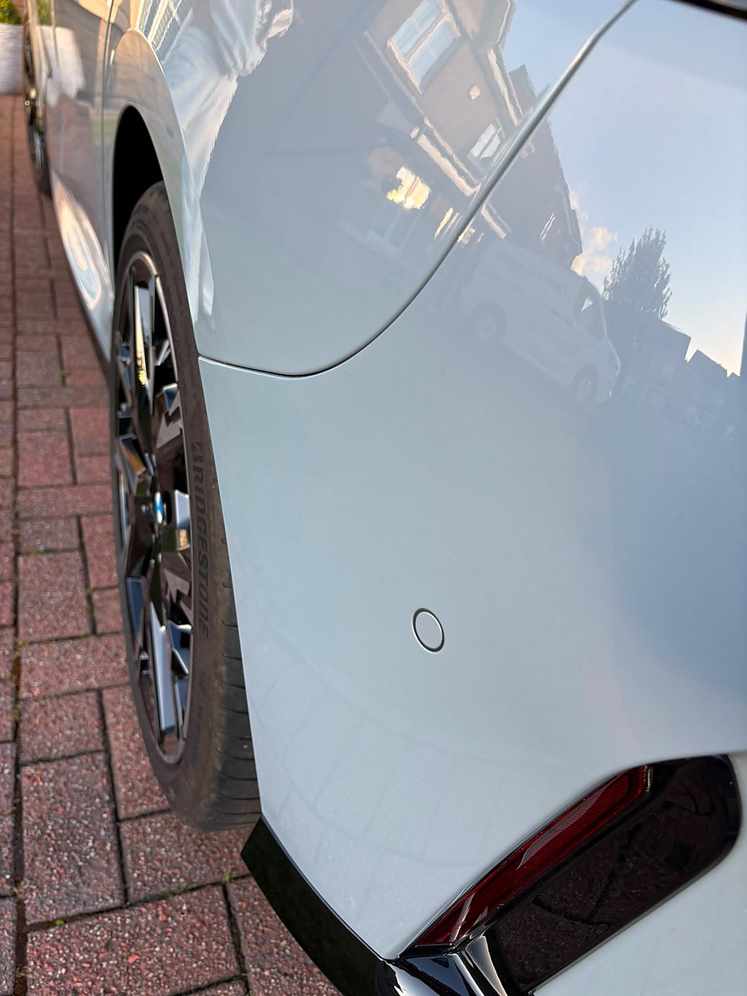 Light blue hatchback after an exterior detail