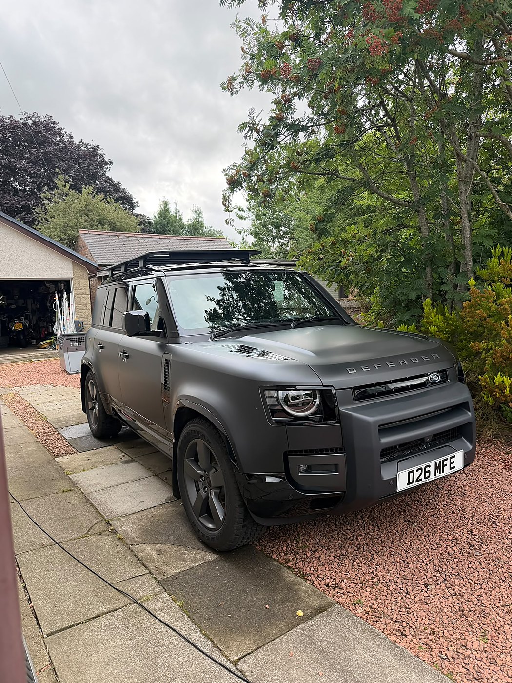 Matte grey Land Rover Defender detailed on the driveway in Falkirk