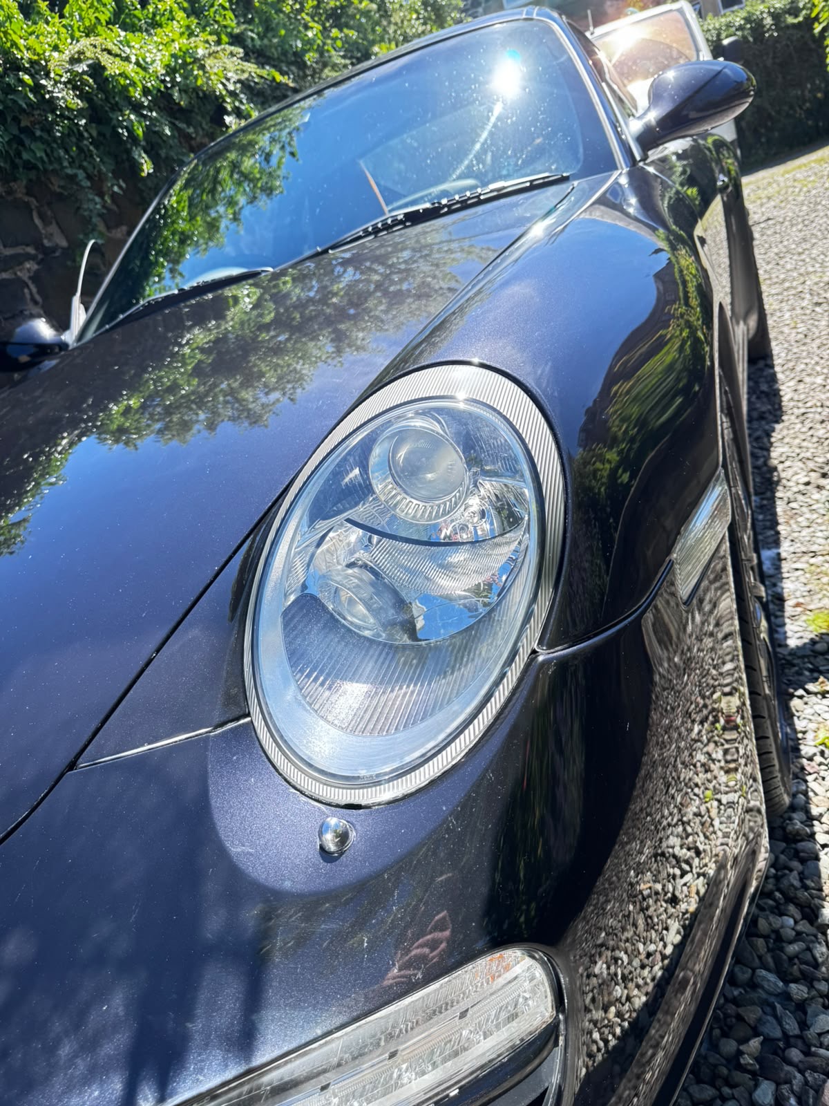Restored headlight lens with full clarity after multi-stage polishing