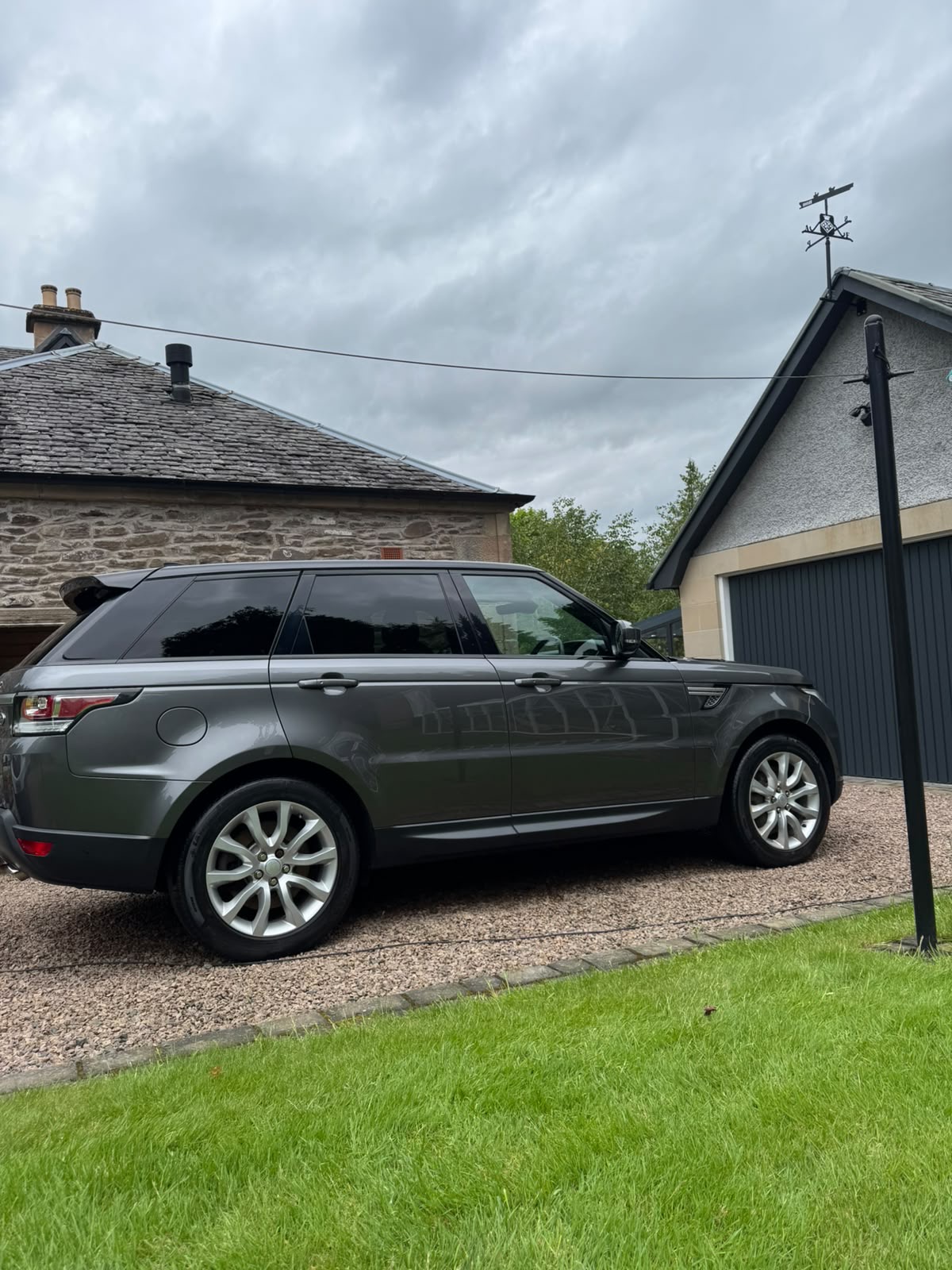 Range Rover Sport with dark rear privacy tints