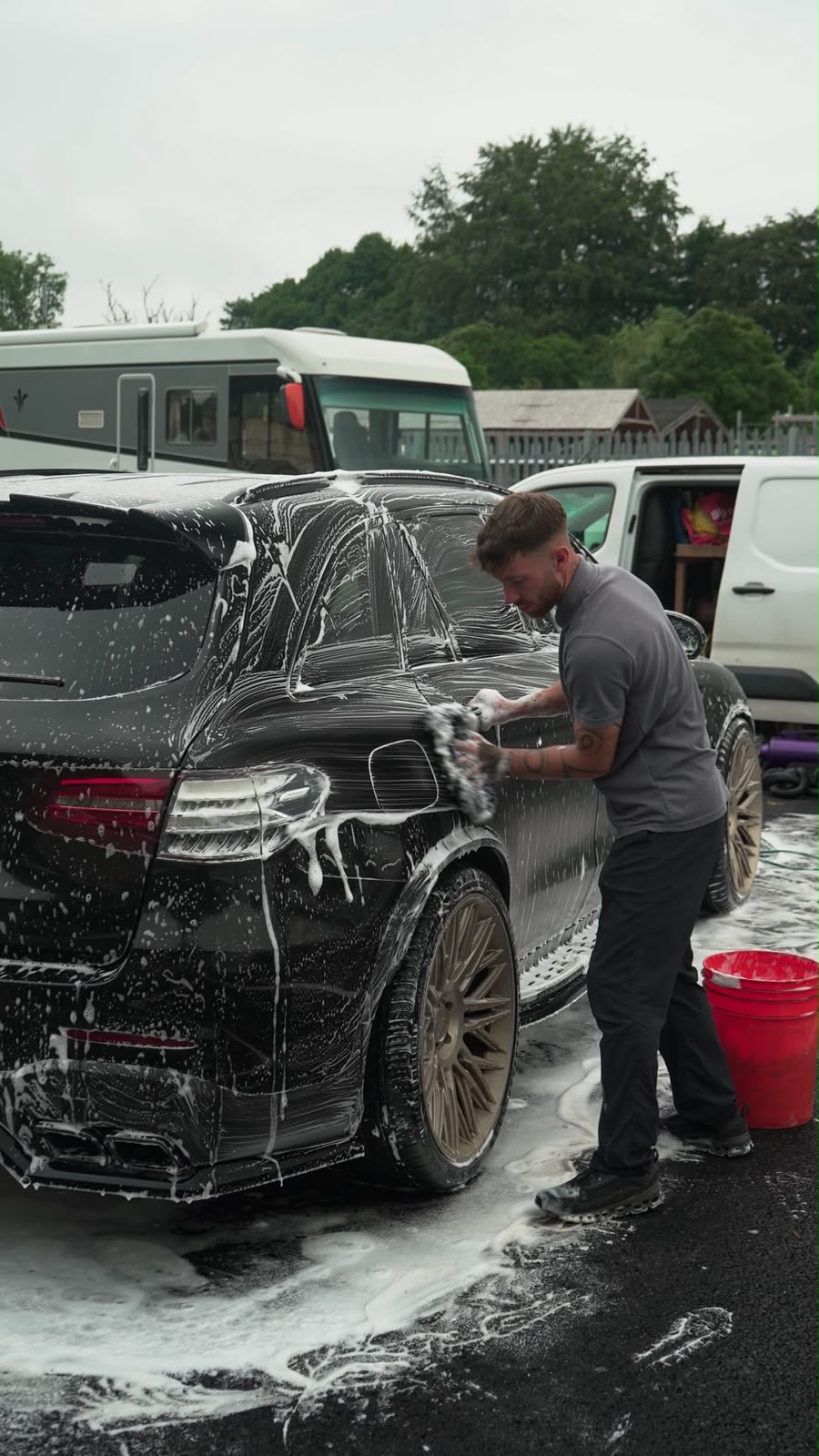 Rinse Revive hand-washing a car with the two-bucket method