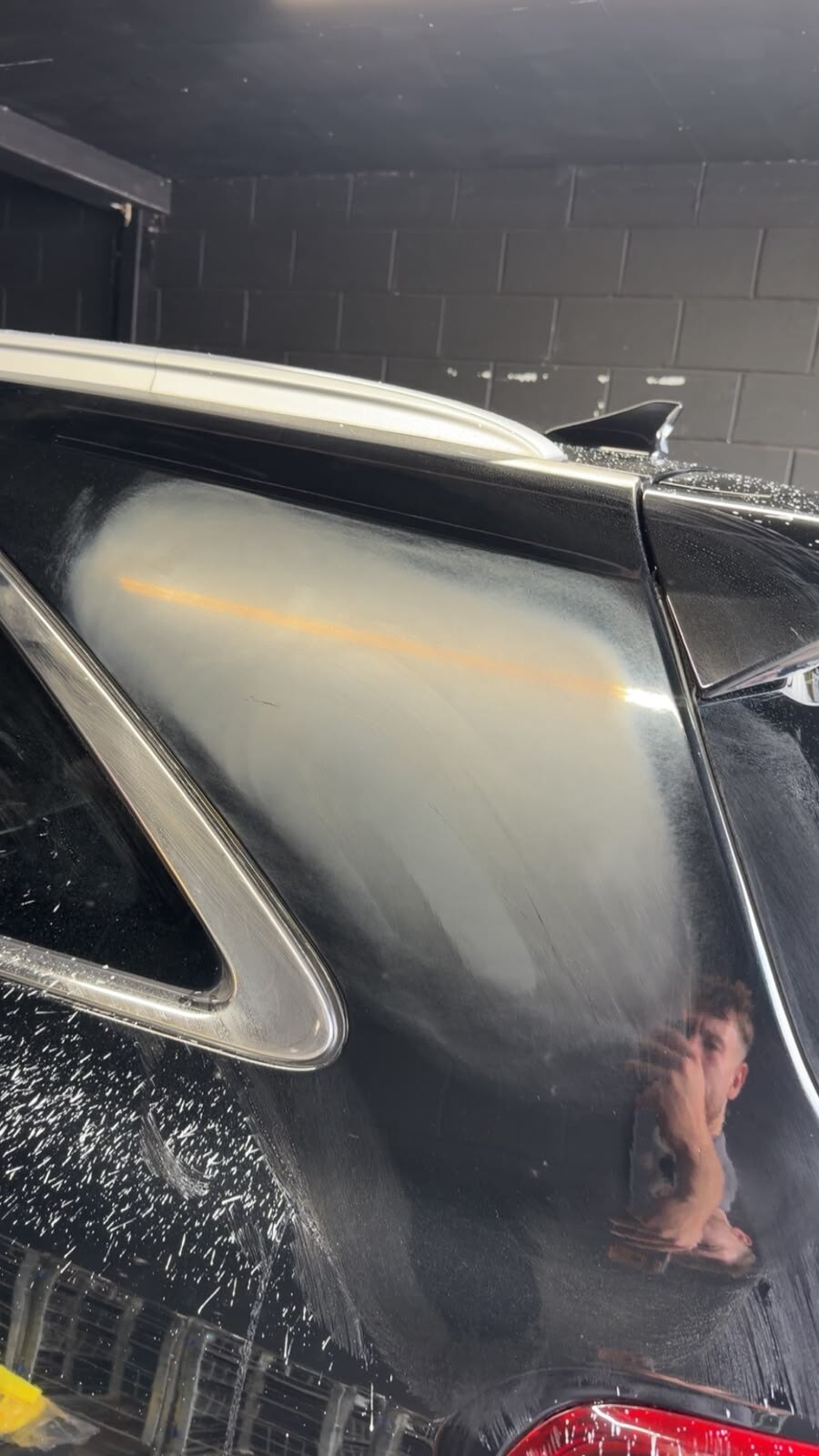 The same panel after sanding, with a matte flatted haze across the pillar and sanding spatter still on the surrounding paint