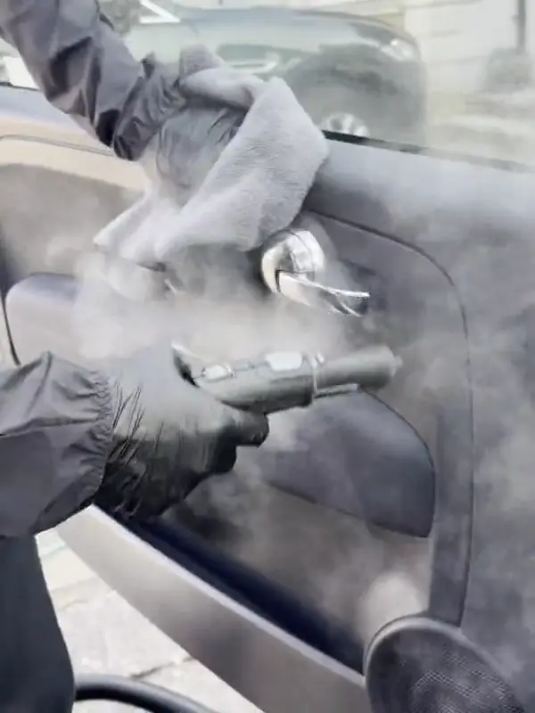 Steam cleaning the door cards during a full valet